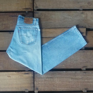 90s Vintage Levi&#39;s 501 Jeans: Faded Light Blue Ripped Denim (W31)