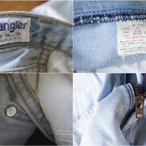 May include: Close-up of light blue denim jeans. The Wrangler label shows a waist size of 78/31. Details include a metal zipper, a button closure, and a care label with Japanese text.