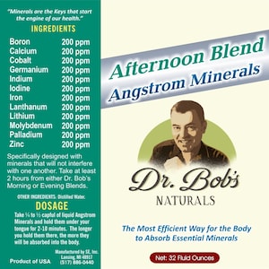 May include: A green and white label with the text "Afternoon Blend Angstrom Minerals" and a picture of a man. The label also includes the text "Dr. Bob's Naturals" and "The Most Efficient Way for the Body to Absorb Essential Minerals". The label also includes the text "Net: 32 Fluid Ounces".