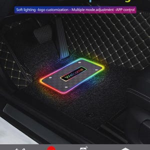 May include: Black car floor mat with a diamond pattern and a rectangular light with the word "Welcome" in the center. The light has a rainbow gradient. The text "Floor mat atmosphere light" is at the top.