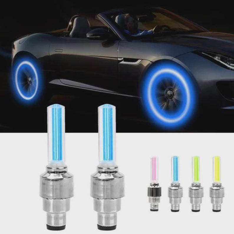 May include: Car wheel lights with blue neon glow. The image shows a convertible car with illuminated wheels, along with several LED valve stem lights in various colors. The lights are designed to enhance the car's appearance.