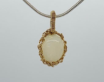 Stability (opal) knit by hand with solid 14K gold wire and sterling silver chain