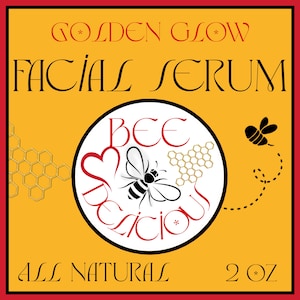 May include: A square label for Golden Glow Facial Serum. The label is yellow with a red border and features the text "Golden Glow Facial Serum" in red and black. A circular graphic in the center says "Bee Delicious" with a bee illustration. The label also says "All Natural" and "2 oz".