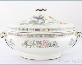 May include: White porcelain serving dish with a lid, featuring a floral pattern with pink, blue, and green accents. The lid has a raised design of a peacock with a blue and green tail.