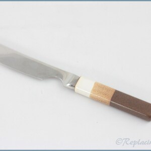 May include: A stainless steel butter knife with a brown, beige, and white handle.