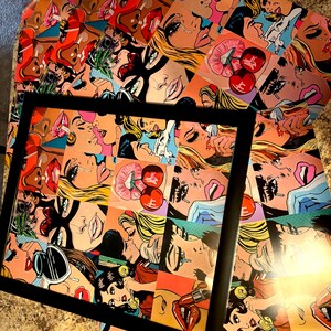 May include: A collection of pop art prints featuring women with bold makeup, tears, and speech bubbles. The prints are in vibrant colors, including red, pink, yellow, and blue. One print is framed in a black frame.