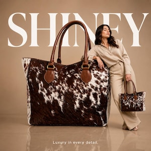 May include: A large tote bag featuring a brown and white cowhide pattern with brown leather handles and gold-tone hardware. The text SHINEY appears in large white letters at the top, and the text Luxury in every detail. appears at the bottom.