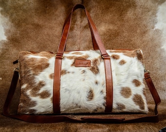 Bolsa de viaje grande de piel auténtica, bolsa de fin de semana de piel de vaca, bolsa de noche en marrón y blanco.