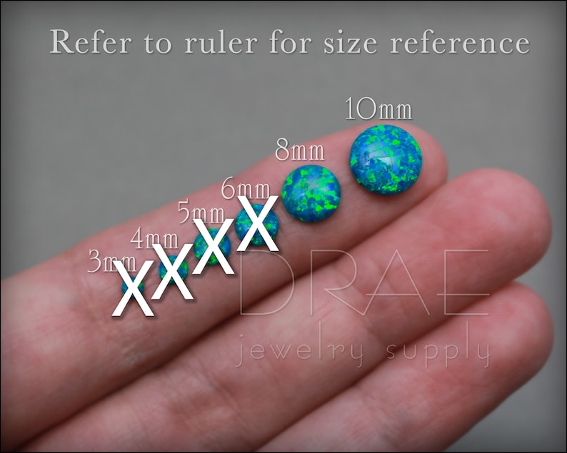 May include: A close-up of a hand holding six different sizes of blue and green opal cabochons. The cabochons are labeled with their size in millimeters: 3mm, 4mm, 5mm, 6mm, 8mm, and 10mm. The text "jewelry supply" is visible below the cabochons.