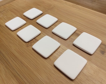 8 square 3.5cm tile ceramic blanks. For painting/decoupage/etc 'cold finish' or pottery kiln glaze firing. Super white earthenware ceramic.