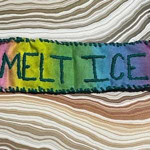 May include: A white ceramic mug with a black handle and the text "But First, Coffee" in a bold, black font. The mug is set against a neutral background, highlighting its simple design.