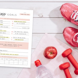 May include: A printable fitness goals worksheet with a pink and yellow color scheme. The worksheet includes sections for top fitness goals, sleep goals, exercise goals, nutrition goals, motivation, and a measurement scale. The worksheet is surrounded by fitness-related items, including pink running shoes, red dumbbells, a red apple, and a clear water bottle.