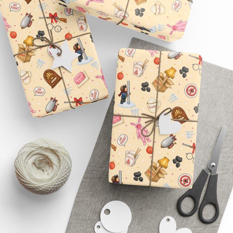 May include: Wrapping paper with a light yellow background featuring a repeating pattern of holiday-themed illustrations including a pink bunny suit, a leg lamp in a box, a radio, a bar of soap, a target, a mug, and the text Oh Fudge in speech bubbles.