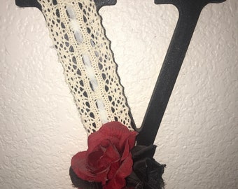 Letters made to order with whatever you feel will look the best make as girly as sparkly or as dark as you want with flowers or with none