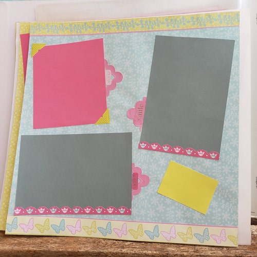 12x12 scrap book ready for your photos full of ribbon, embellishments and more, photo shops book memory book scrap book