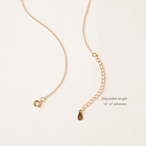 May include: Gold chain necklace with an adjustable length of 16 inches plus a 2 inch extender. The chain has a lobster clasp closure.