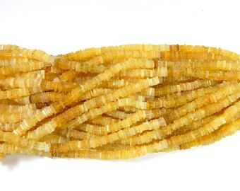 May include: A strand of yellow opal beads, each bead is a square shape with a slightly irregular cut. The beads are strung together on a clear thread.