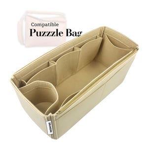 May include: Beige felt bag organiser with multiple compartments and a gold zip. The organiser is designed to fit a Puzzle Bag. The text "Compatible Puzzle Bag" is visible in the image. The brand name "SILKON" is also visible.