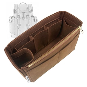 May include: A brown felt bag organiser with multiple compartments and a gold zip. The organiser is designed to fit inside a backpack, as suggested by the sketch in the background. The label on the side reads "SILKON".