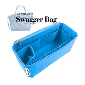 May include: A bright blue bag organizer with multiple compartments and a gold zipper. The text "Compatible Swagger Bag" is displayed above the organizer. The brand name "SILKON" is printed on a white tag.