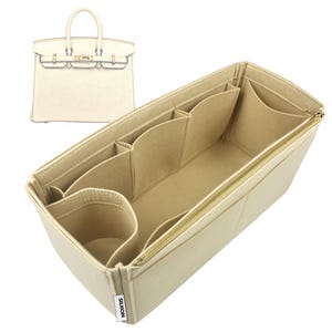 May include: A set of three ceramic mugs with a speckled, matte finish. The mugs are in shades of cream, light gray, and dark gray. Each mug has a simple, minimalist design and a rounded handle. Perfect for coffee or tea.