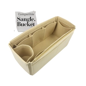 Può includere: Organizzatore per borsa in feltro beige con più tasche e chiusura a zip. L'organizzatore è compatibile con la borsa "Sangle. Bucket".