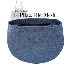 May include: A blue felt bag organiser with a black zip closure. The text "Compatible Le Pliag. Filet Mesh" is printed above the bag. The organiser is designed to fit inside a handbag.