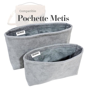 Könnte beinhalten: Zwei graue Stoff-Organizer, einer etwas kleiner als der andere, mit dem Text "SILKON" auf einem weißen Etikett. Die Organizer sind für die Verwendung in einer Handtasche konzipiert. Der Text "Compatible Pochette Metis" befindet sich oben.