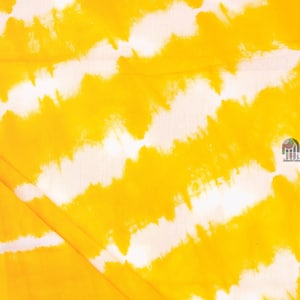 May include: Yellow and white tie-dye fabric with a wavy pattern.
