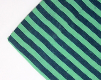 May include: Green and black striped fabric with a diagonal pattern.