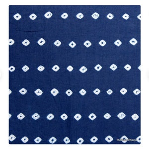 May include: A blue fabric with a white diamond pattern. The fabric is a traditional Japanese shibori tie-dye.