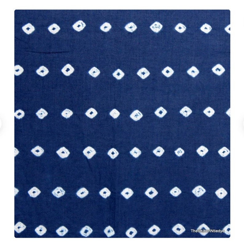 May include: A blue fabric with a white diamond pattern. The fabric is a traditional Japanese shibori tie-dye.