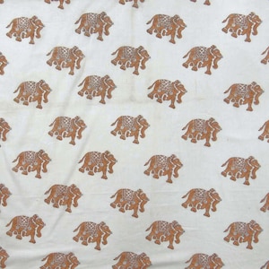 May include: White fabric with a repeating pattern of brown elephants. The elephants are facing different directions and are in various positions.