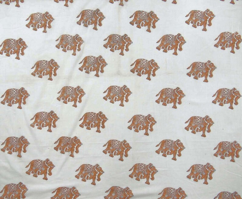 May include: White fabric with a repeating pattern of brown elephants. The elephants are facing different directions and are in various positions.