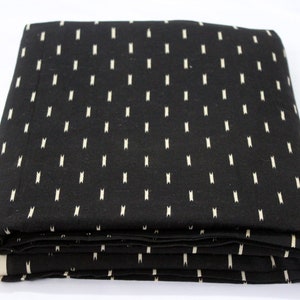 May include: Black fabric with a white, repeating pattern of small vertical lines.