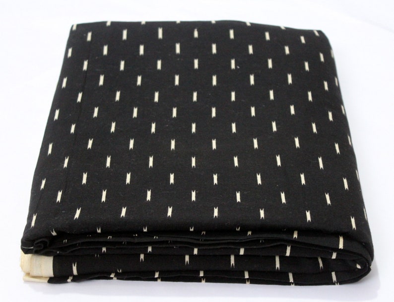 May include: Black fabric with a white, repeating pattern of small vertical lines.