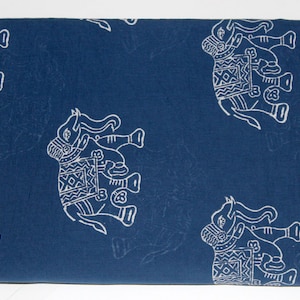 May include: A blue cotton fabric with a white elephant pattern. The elephants are decorated with geometric designs.