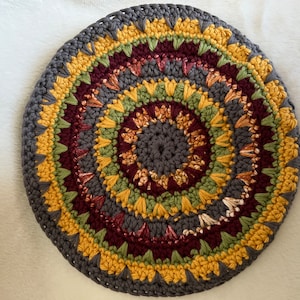 Round double thick hot pad in gold, sage, maroon, and charcoal