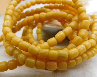 5-6 mm approx 60 cm strand with 110-130 beads yellow orange small handmade ethno glass beads java