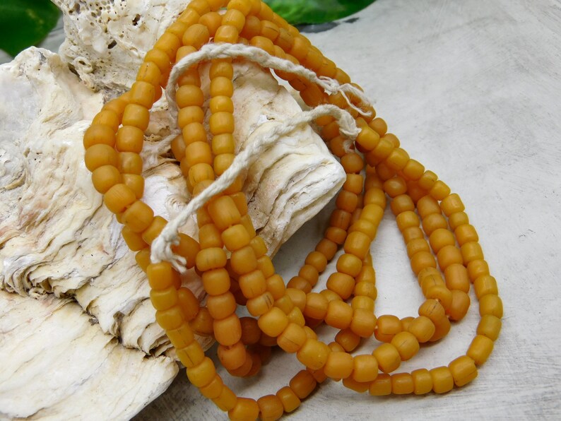 5-6 mm approx 60 cm strand with 110-130 beads yellow orange small handmade ethno glass beads java