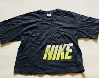 navy blue and neon green nike shirt