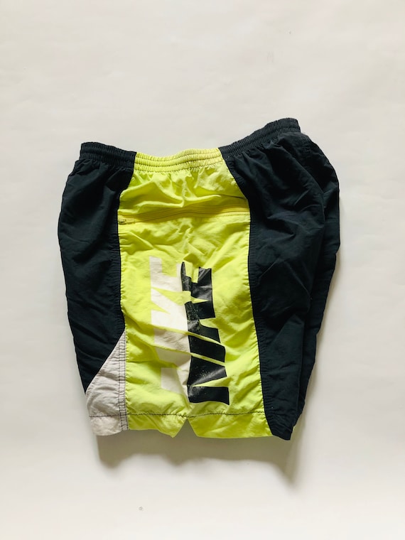 yellow nike swim trunks