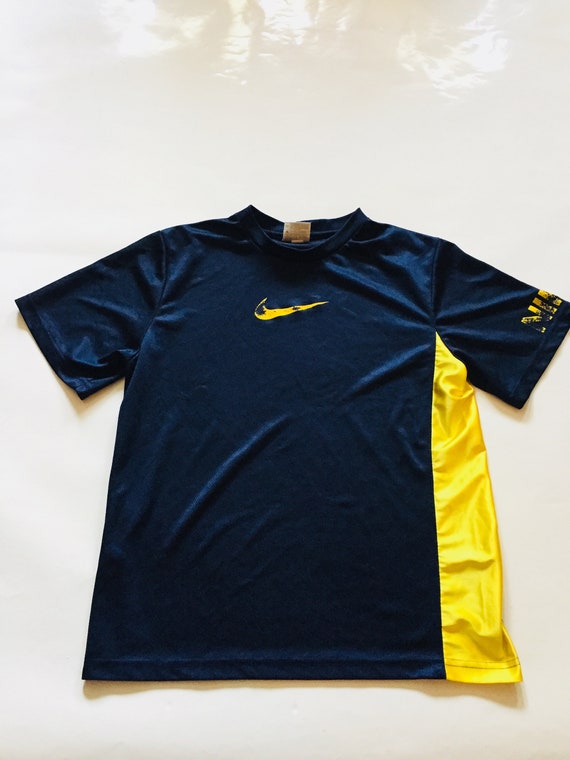 blue and yellow nike shirt
