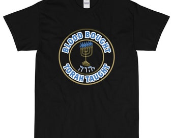 May include: Black t-shirt with a gold circle design featuring a menorah with blue flames and the text "Blood Bought Torah Taught".