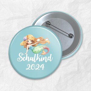 Bouton écolier cadeau de scolarisation cartable sirène