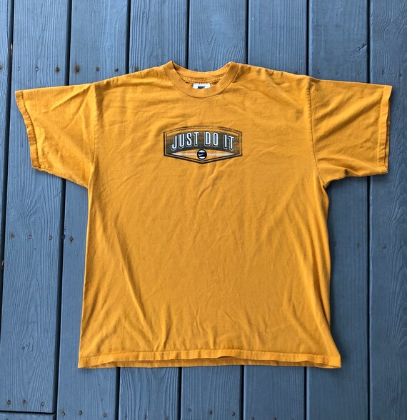 mustard yellow nike shirt