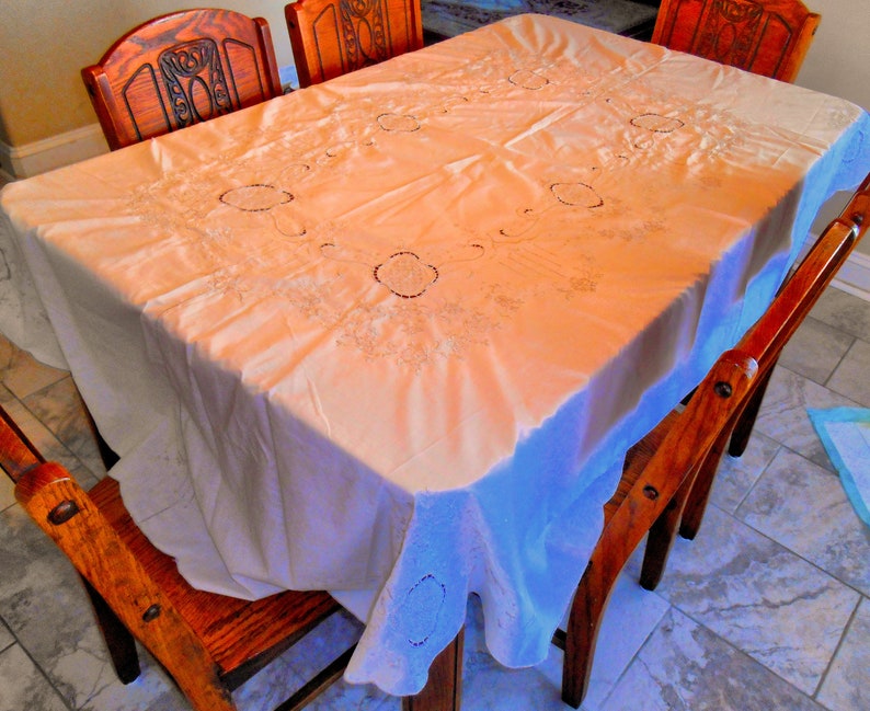 Beautiful Oval Tablecloth Lite Cream With Lots of Lite Taupe Colored Embroidery...Scalloped Edge