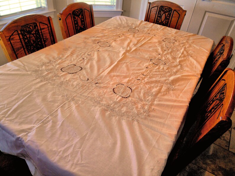 Beautiful Oval Tablecloth Lite Cream With Lots of Lite Taupe Colored Embroidery...Scalloped Edge