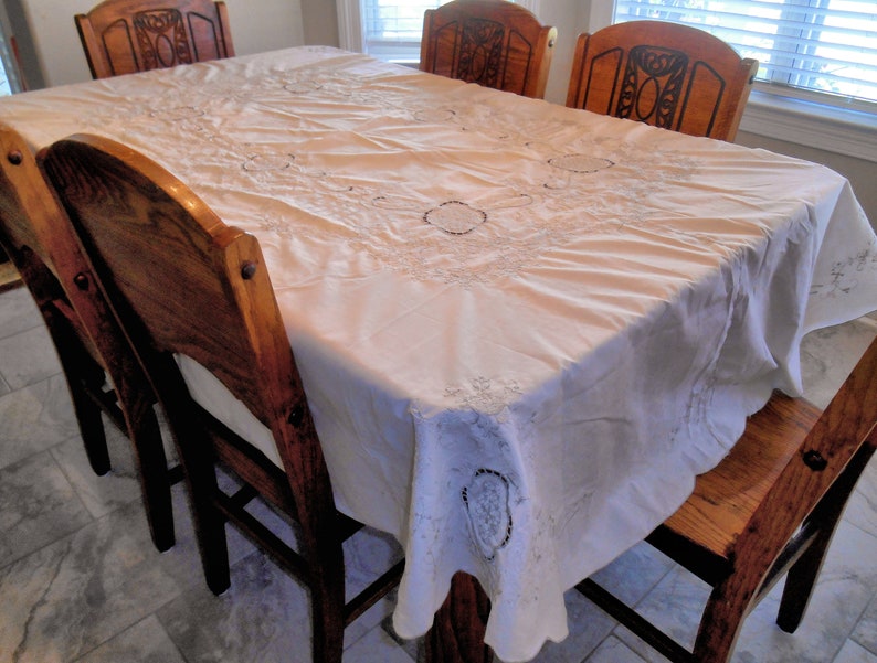 Beautiful Oval Tablecloth Lite Cream With Lots of Lite Taupe Colored Embroidery...Scalloped Edge