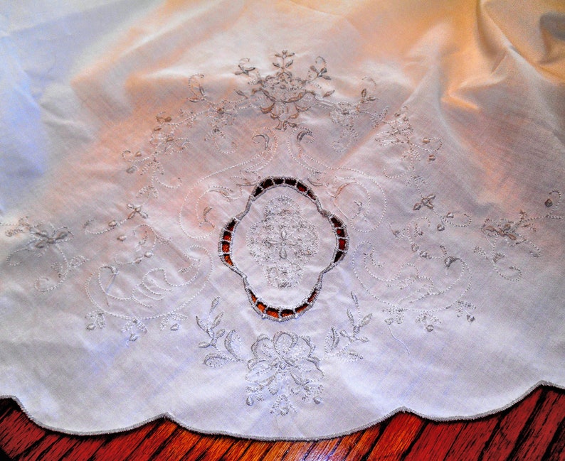 Beautiful Oval Tablecloth Lite Cream With Lots of Lite Taupe Colored Embroidery...Scalloped Edge